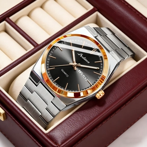 Detailed shot of steel watch with dual calendar display and elegant gold bezel in gift box