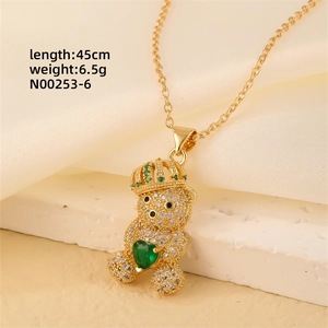 Detail of bear pendant with green heart stone and zircons, length 45cm weight 6.5g