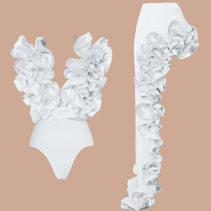 Detailed close-up of white ruffled V-neck bodysuit with matching layered leg sleeves