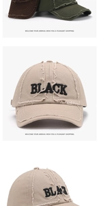 Close-up of distressed vintage baseball cap with BLACK embroidery and worn-out details