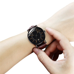 Geneva men's business quartz watch with brown leather strap and black dial on wrist