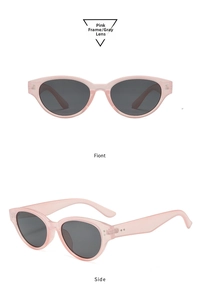 Detailed view of pink cat-eye sunglasses with gray lenses and metallic rivet accents