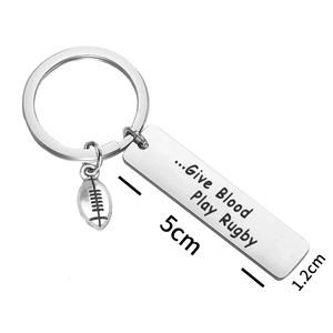 Rugby themed stainless steel keychain with Give Blood Play Rugby engraved tag