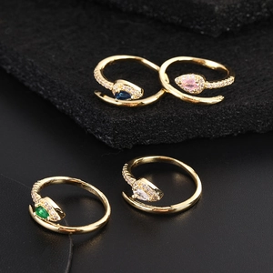 Detail of adjustable bohemian snake rings with colorful pear-cut zircons and gold plating