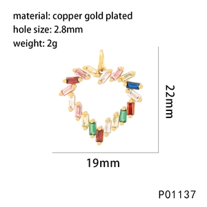Macro detail of heart charm with multi-color gemstones and size specs in mm