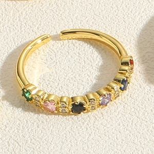 Macro shot of 14K gold plated bamboo ring with colorful cubic zirconia and white diamonds
