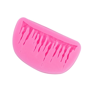 Pink silicone fondant mold with icicle drip pattern for decorative cake borders