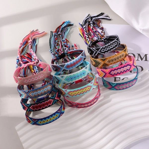 Handmade colorful Bohemian friendship bracelets with geometric patterns and tassels