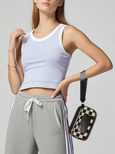 Detail view of checkerboard pouch with transparent window and VIP lettering on wristband