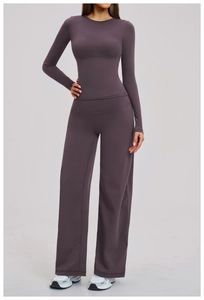 Women's yoga set featuring long sleeve top and high waist wide leg pants in mauve