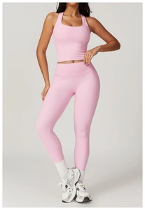 Detailed view of the racerback sports bra and high-waist yoga leggings in light pink