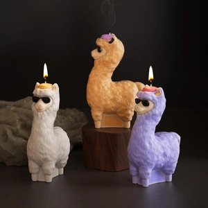 Alpaca scented candle silicone molds with sunglasses and hats on dark background