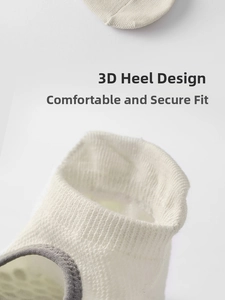 Close-up of cotton yoga sock with 3D heel design and gray piping for anti-slip grip