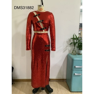 Detail of red sequin two-piece set with long sleeves and cutout buckle decorations