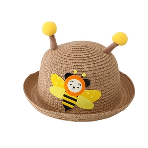 Kids woven straw sun hat with cute cartoon bee and plush pom-pom antennae detail