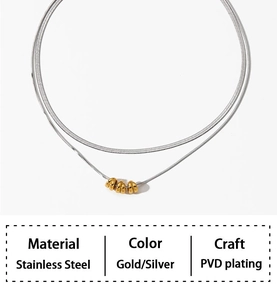 Macro detail of double-layered stainless steel snake chain in gold and silver finish