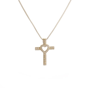 Golden cross necklace with micro-paved heart-shaped center on a white background