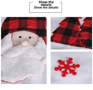 Detail of buffalo plaid Santa Claus and snowflake patches on a plush Christmas tree skirt
