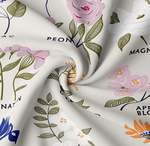 Macro shot of floral tapestry fabric with peony and magnolia prints on soft woven material