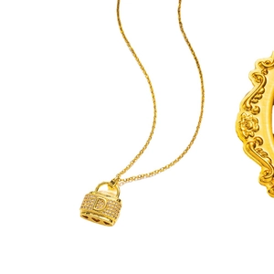 Golden titanium steel necklace featuring a letter D handbag pendant with micro-inlaid diamonds