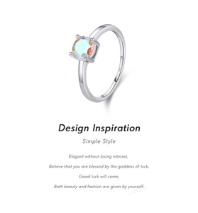 Detailed view of S925 sterling silver ring with sparkling round fire opal center stone