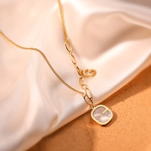 Gold-plated titanium steel necklace with shell inlay square pendant and G charm on silk