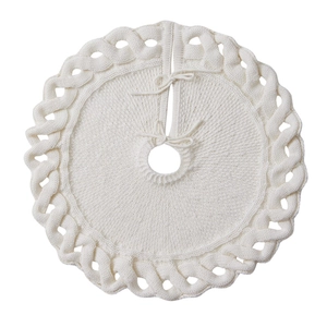 White knitted Christmas tree skirt with braided cable borders and tie closures