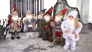 Detailed view of six luxury 45cm Santa Claus figurines with knitted fabrics and fur