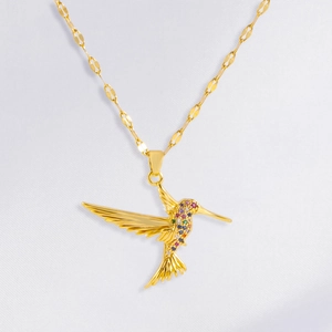 Gold hummingbird pendant necklace with multi-color zircon stones on unique olive link chain