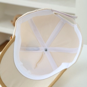 Detailed interior of kids' cotton baseball cap featuring six-panel stitching and sweatband