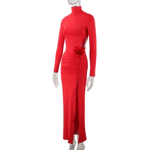 Detail of red high neck dress featuring waist cutout with 3D floral accent and high slit