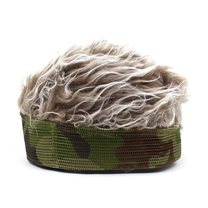 Detail showing camouflage baseball cap with light brown curly wig hair for costumes