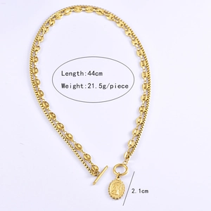 Detail of gold coin pendant necklace with OT toggle clasp and 44cm dual link chain