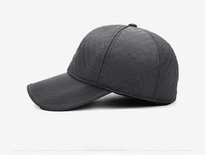 Side profile of a dark grey quilted baseball cap with classic diamond stitching