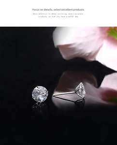 Macro shot of S925 silver four-claw stud earrings with round brilliant-cut cubic zirconia