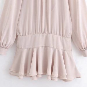 Elegant nude pink chiffon dress featuring an elastic waist and layered ruffle hemline