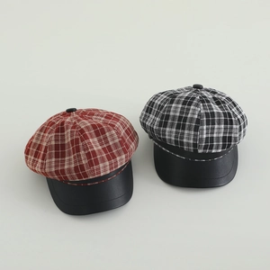 Plaid newsboy caps for girls with black leather brims in red and monochrome colors