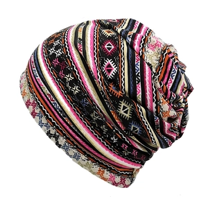 Detailed view of bohemian style turban hat featuring colorful ethnic geometric patterns