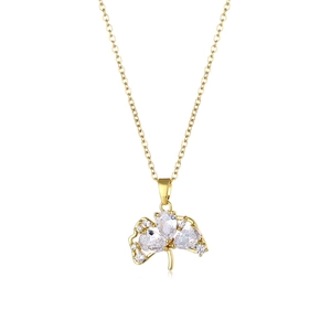 Golden ginkgo leaf necklace with sparkling zirconia stones on a white background