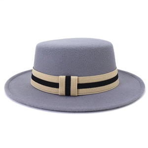 Detailed texture of grey wool felt boater hat with a striped ribbon band