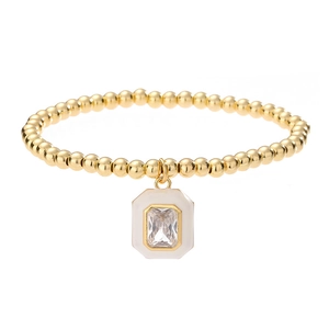 Gold beaded bracelet with white enamel geometric pendant and rectangular zircon stone