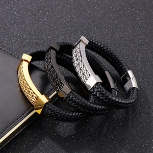 Detailed view of woven leather bracelets for men with polished magnetic clasps