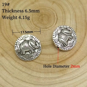 Detail of vintage elephant embossed silver spacer beads with 17.5mm diameter and 2mm hole