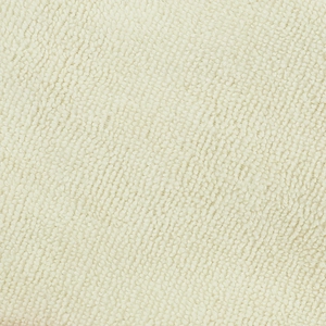 Makroaufnahme von cremefarbenem Baumwoll-Frottee mit weicher Textur und saugfähigen Fasern