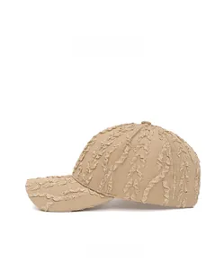 Side view of beige baseball cap featuring textured seersucker fabric and wave patterns