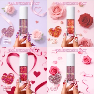 Close-up of four colors glitter gel with heart-shaped swatches for Valentine's nail art