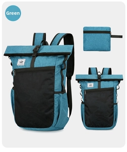 Detail of teal waterproof backpack with roll-top closure and mesh zipper pocket