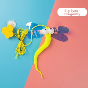 Close-up of a dragonfly cat toy with laser wings and a yellow plush body with big eyes