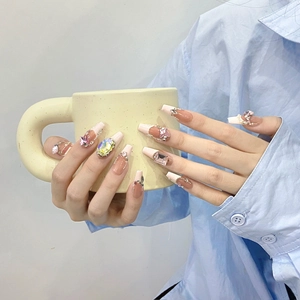Luxury long coffin press-on nails with pink glitter, 3D bows, and gradient crystal accents