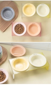 U-shaped acrylic stands holding colorful ceramic pet bowls with LOVELY.CAT text